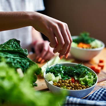 Woman preparing healthy meal in kitchen
