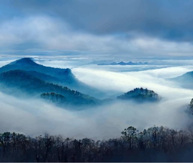 Landscape shot of mountains covered by clouds