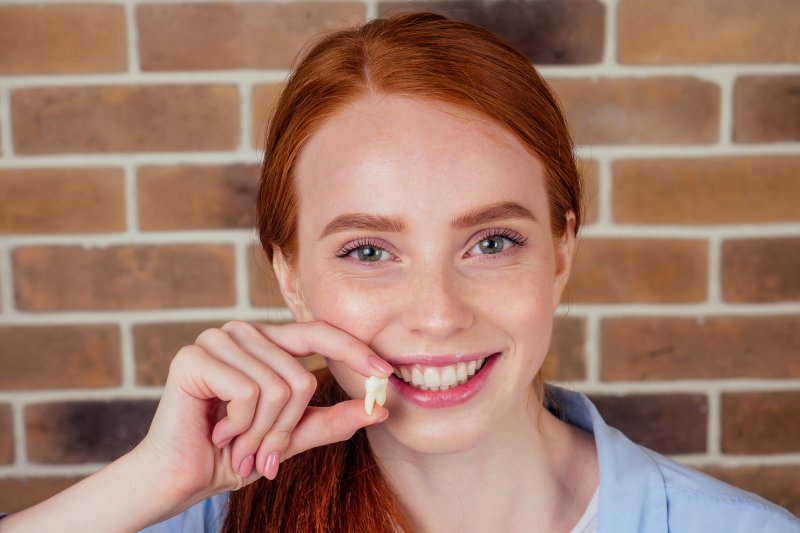 Smiling woman with tooth