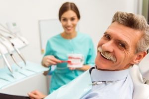 Man at dentist for mini dental implants