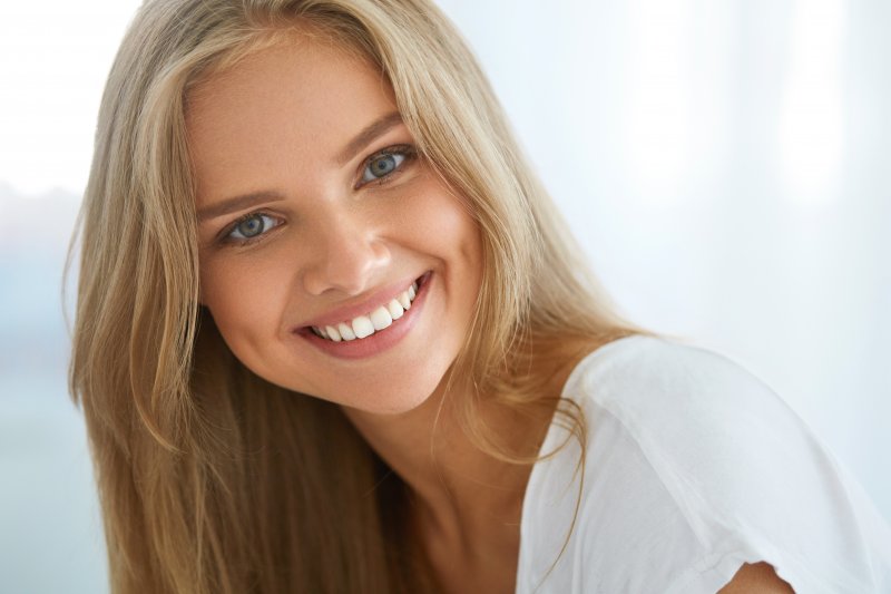 closeup of woman smiling after teeth whitening 