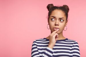 Woman wondering if she can get mini dental implants